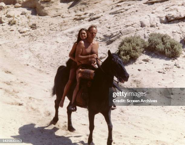 Planet Of The Apes Charlton Heston and Linda Harrison ride horse from the 1968 movie.