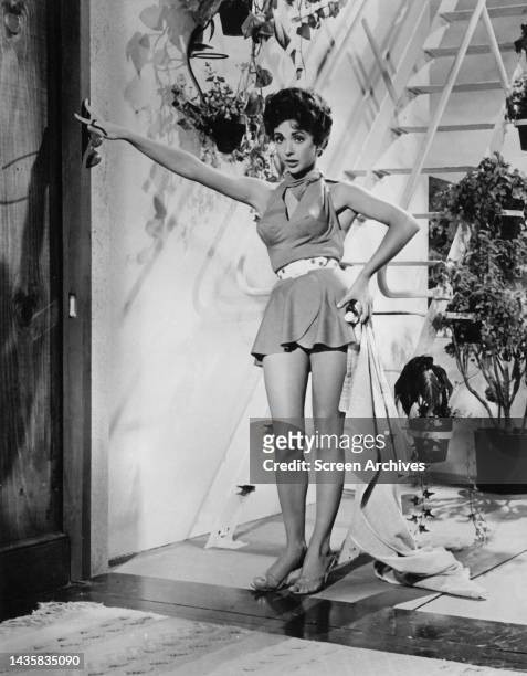 Rita Moreno barefoot publicity portrait of the EGOT Emmy, Oscar, Golden Globe and Tony award winning Puerto Rican actress circa 1958.