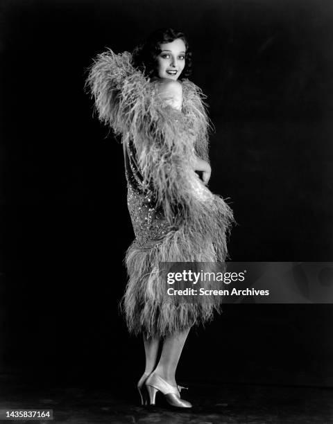 Sally Blane striking flapper girl glamour pose in 1920's fashion.