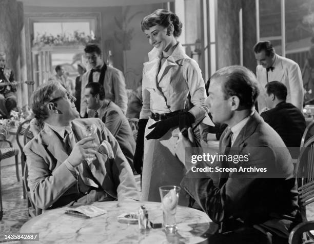 Audrey Hepburn pictured in one of her earliest roles alongside Alec Guinness in the 1951 Ealing studios comedy The Lavender Hill Mob.