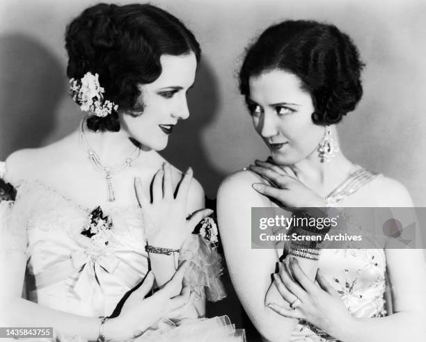 Mary Brian and Doris Hill exchange glances in a Pre Code portrait of the 1920's flapper girls.