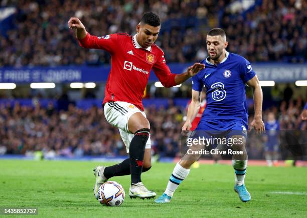 Casemiro of Manchester United battles for possession with Mateo Kovacic of Chelsea during the Premier League match between Chelsea FC and Manchester...