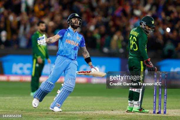 Virat Kohli of India celebrates after the final run is scored during the ICC Men's T20 World Cup match between India and Pakistan at Melbourne...