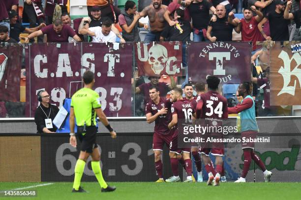 Pietro Pellegri of Torino FC celebrates with teammates after scoring their team's second goal during the Serie A match between Udinese Calcio and...