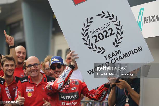 Francesco Bagnaia of Italy and Ducati Lenovo Team celebrates the victory of the race and 2022 MotoGP Team World Champion under the podium during the...