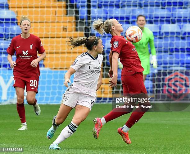 Emma Koivisto of Liverpool Women competing with Katie McCabe of Arsenal Women during the FA WSL match between Liverpool Women and Arsenal Women at...