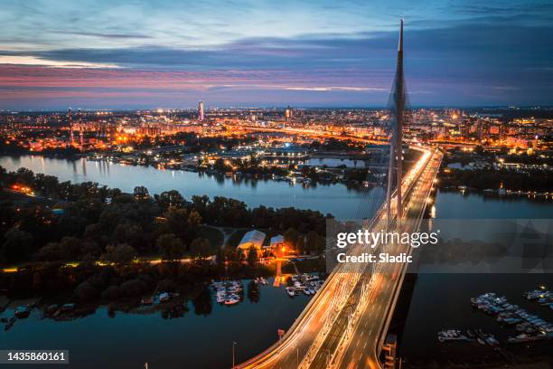 new, modern bridge on the river sava, belgrade, serbia. - belgrade skyline imagens e fotografias de stock