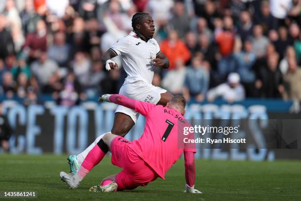 Michael Obafemi of Swansea City scores their side's second goal as Ryan Allsop of Cardiff City attempts to make a save during the Sky Bet...