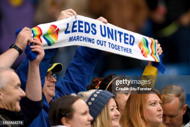 Fans of Leeds United hold a scarf with the rainbow colours prior to the Premier League match between Leeds United and Fulham FC at Elland Road on...