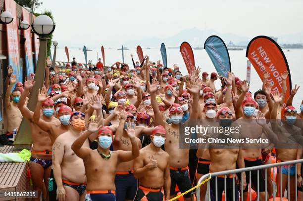 Swimmers get ready for the New World Harbour Race 2022 on October 23, 2022 in Hong Kong, China. The race started at the Golden Bauhinia Square Public...