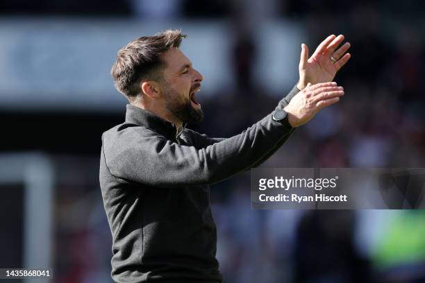 Russell Martin, Manager of Swansea City, celebrates their side's win in front of their fans after the final whistle of the Sky Bet Championship...