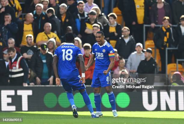 Youri Tielemans of Leicester City celebrates with teammates after scoring their team's first goal during the Premier League match between...