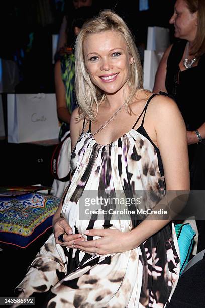 Actress Holly Brisley watches front row ahead of the Camilla on the catwalk on day one of Mercedes-Benz Fashion Week Australia Spring/Summer 2012/13...