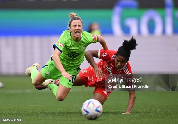 Svenja Huth of Wolfsburg is challenged by Tainara of Bayern Muenchen during the FLYERALARM Women's Bundesliga match between VfL Wolfsburg and Bayern...