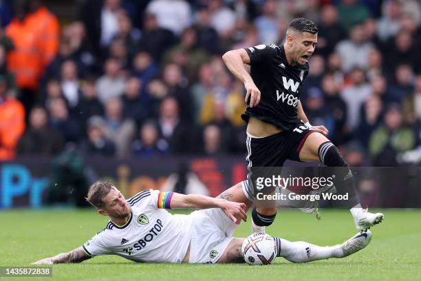 Andreas Pereira of Fulham is fouled by Liam Cooper of Leeds United during the Premier League match between Leeds United and Fulham FC at Elland Road...