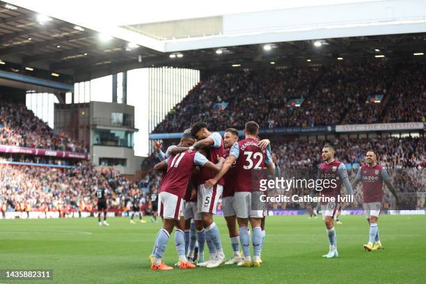 Ollie Watkins of Aston Villa celebrates with teammates after scoring their team's fourth goal during the Premier League match between Aston Villa and...