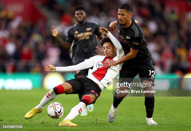 Mohammed Salisu of Southampton is challenged by William Saliba of Arsenal during the Premier League match between Southampton FC and Arsenal FC at...