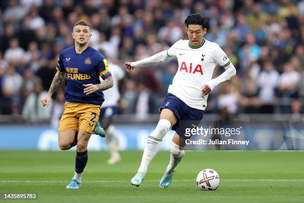 Son Heung-Min of Tottenham Hotspur is challenged by Kieran Trippier of Newcastle United during the Premier League match between Tottenham Hotspur and...