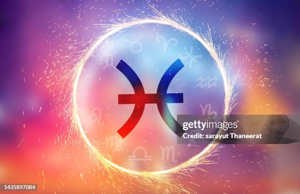 pisces symbol on a colorful background light - zodiac pisces stockfoto's en -beelden