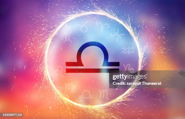 libra symbol on a colorful background light - waage stock-fotos und bilder