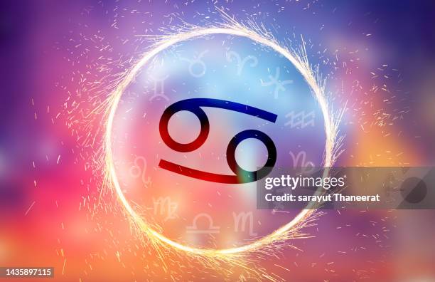 zodiac cancer symbol on a colorful background light - signs of the zodiac stock pictures, royalty-free photos & images