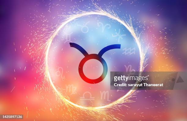 taurus symbol on a colorful background light - star signs fotografías e imágenes de stock