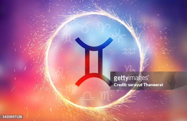 gemini symbol on a colorful background light - taurus stock-fotos und bilder