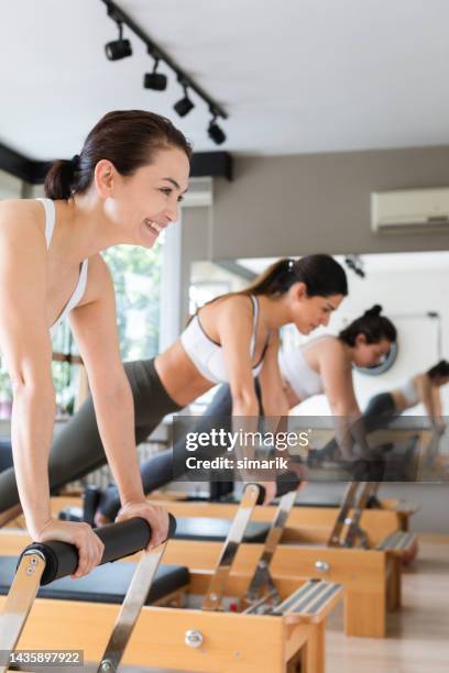 pilates - reformer stock pictures, royalty-free photos & images