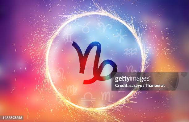 capricorn symbol on a colorful background light - signe du verseau photos et images de collection