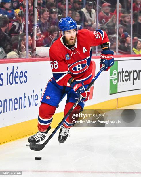 David Savard of the Montreal Canadiens skates the puck against the Dallas Stars during the first period at Centre Bell on October 22, 2022 in...
