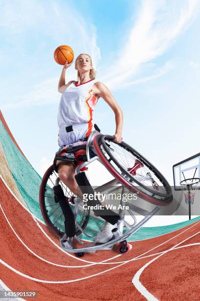 professional wheelchair basketball player on court - trying on ストックフォトと画像