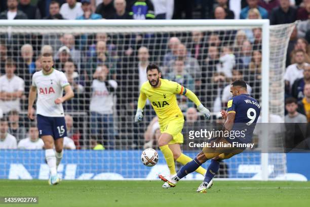 Callum Wilson of Newcastle United scores their team's first goal past Hugo Lloris of Tottenham Hotspur during the Premier League match between...