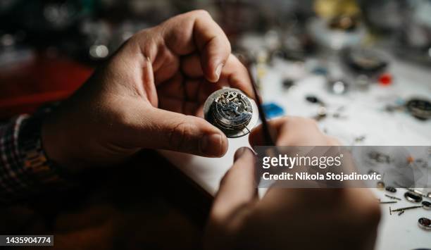 watchmaker's workshop - clockwork stock pictures, royalty-free photos & images