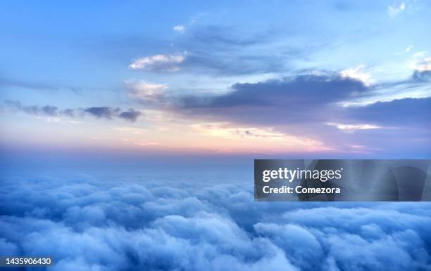 mid-air cloudscape backgrounds at sunrise - airplane overhead view stock pictures, royalty-free photos & images