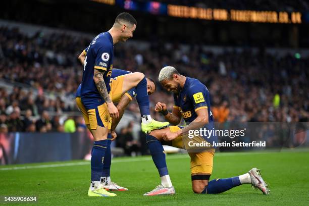 Miguel Almiron celebrates with Joelinton of Newcastle United after scoring their team's second goal during the Premier League match between Tottenham...