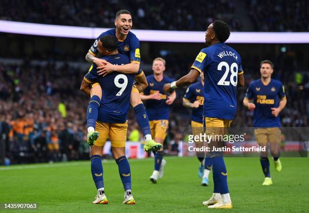 Miguel Almiron celebrates with Callum Wilson of Newcastle United after scoring their team's second goal during the Premier League match between...