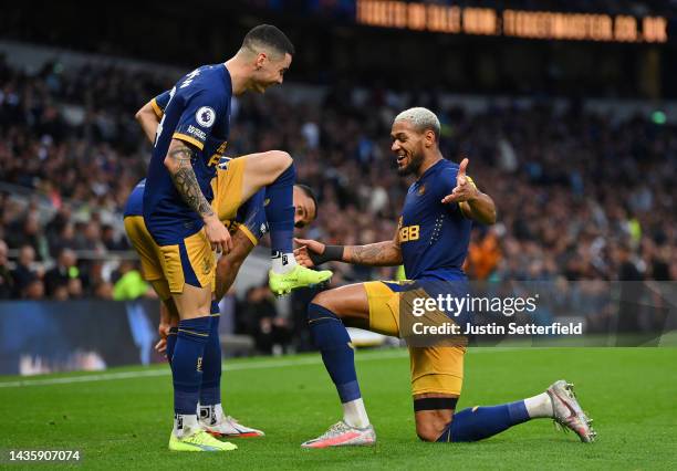 Miguel Almiron celebrates with Joelinton of Newcastle United after scoring their team's second goal during the Premier League match between Tottenham...