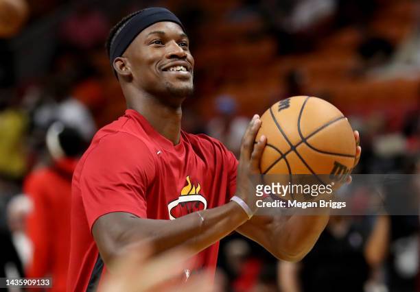 Jimmy Butler of the Miami Heat smiles during warm-ups prior to playing the Toronto Raptors at FTX Arena on October 22, 2022 in Miami, Florida. NOTE...