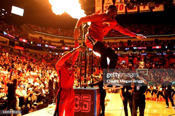 Udonis Haslem of the Miami Heat helps up teammate Bam Adebayo of the Miami Heat prior to the playing the Boston Celtics at FTX Arena on October 21,...