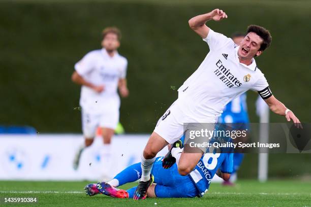 Carlos Dotor of Real Madrid Castilla battle for the ball with Roberto Olabe of Deoprtivo de la Coruna during the Primera RFEF match between Real...