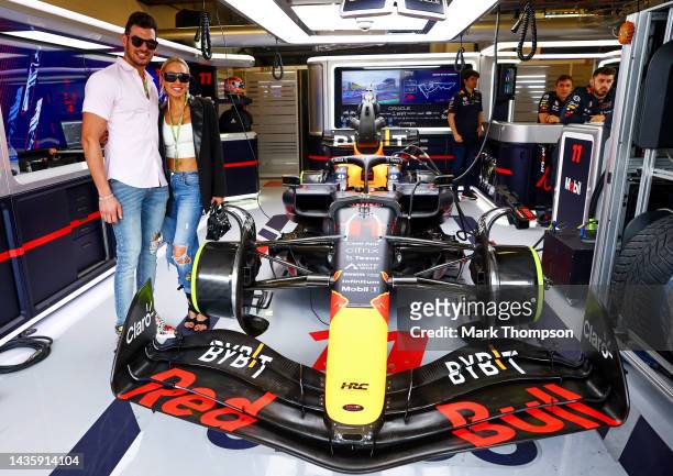 Mary Fitzgerald and Romain Bonnet pose for a photo in the Red Bull Racing garage prior to the F1 Grand Prix of USA at Circuit of The Americas on...