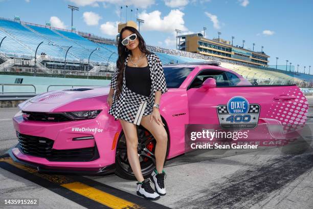 Singer Natti Natasha poses for photos before pace car training prior to the NASCAR Cup Series Dixie Vodka 400 at Homestead-Miami Speedway on October...