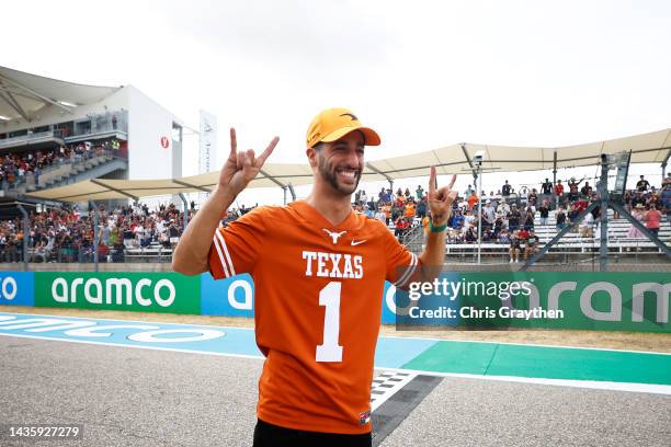 Daniel Ricciardo of Australia and McLaren waves to the crowd on the drivers parade prior to the F1 Grand Prix of USA at Circuit of The Americas on...