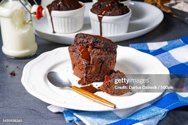 delicious chocolate muffins with chocolate chips - lava cake stock pictures, royalty-free photos & images