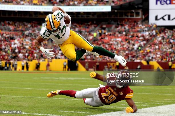 Allen Lazard of the Green Bay Packers dodges after a reception during the first quarter of the game against the Washington Commanders at FedExField...
