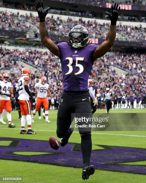 Gus Edwards of the Baltimore Ravens celebrates after scoring a touchdown during the second quarter of the game against the Cleveland Browns at M&T...