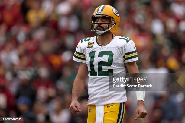 Aaron Rodgers of the Green Bay Packers reacts after a play during the first quarter of the game against the Washington Commanders at FedExField on...