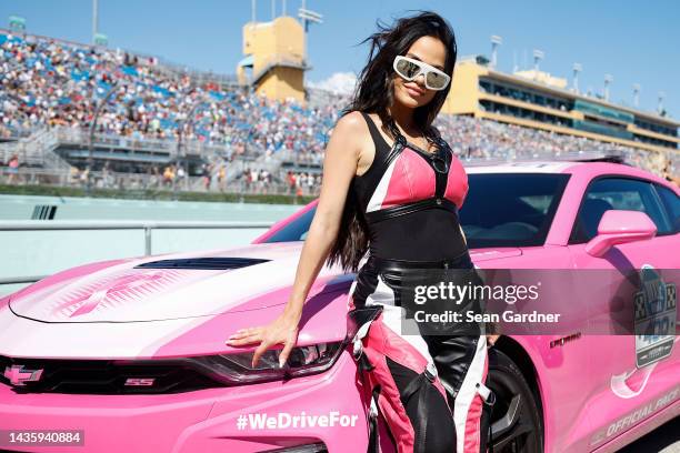 Singer Natti Natasha poses for photos before driving the pace car prior to the NASCAR Cup Series Dixie Vodka 400 at Homestead-Miami Speedway on...