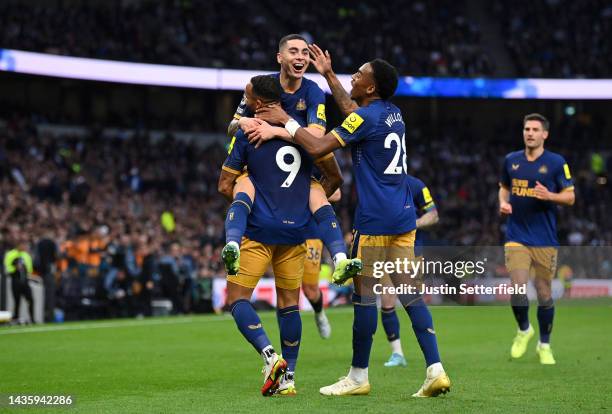 Miguel Almiron celebrates with Callum Wilson of Newcastle United after scoring their team's second goal during the Premier League match between...