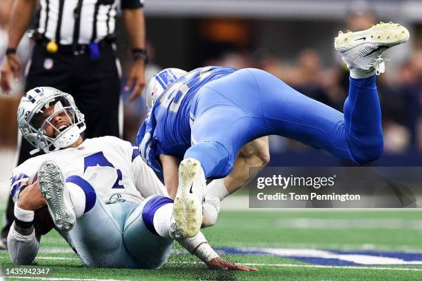 Curtis Brooks of the Indianapolis Colts sacks Dak Prescott of the Dallas Cowboys during the third quarter at AT&T Stadium on October 23, 2022 in...